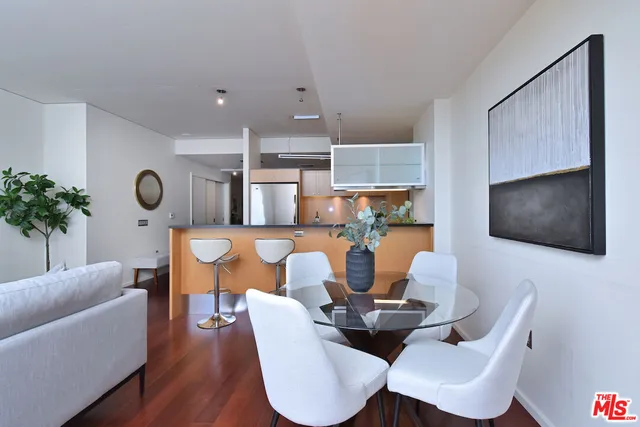 a kitchen with stainless steel appliances granite countertop a sink and a microwave