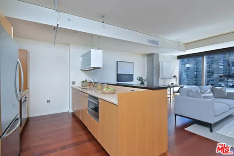 a view of living room with furniture and a large window