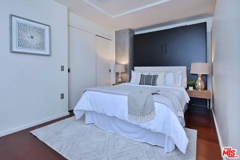 a bedroom with a bed and a table