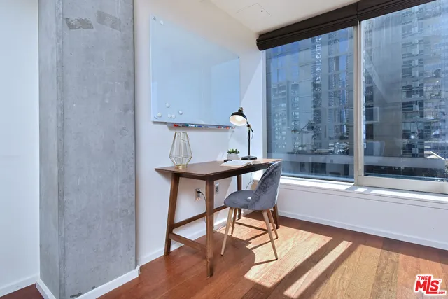 a view of a room that has a table and chairs in it
