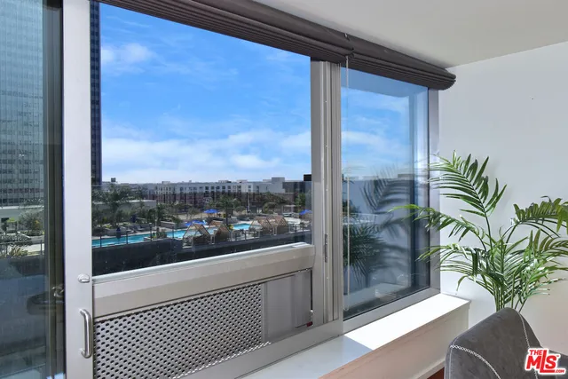 a view of a glass door and a window