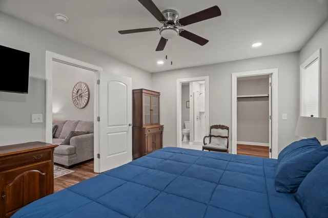 a bedroom with a bed and a couch