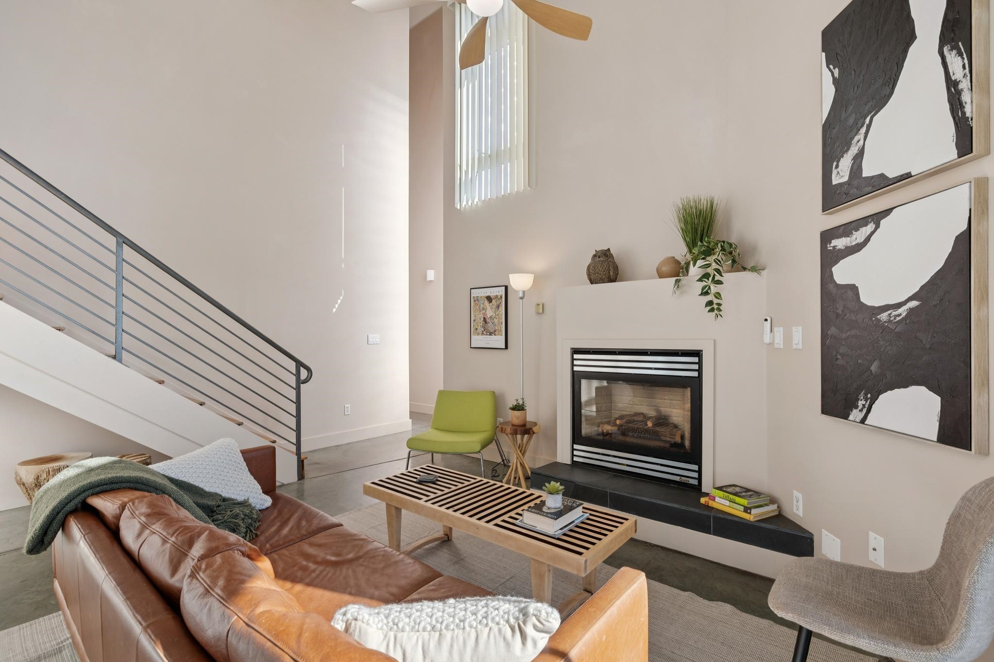 675 8th Street, Unit 10 Oakland, CA 94607 - Photo 18 of 40 a living room with furniture and a fireplace