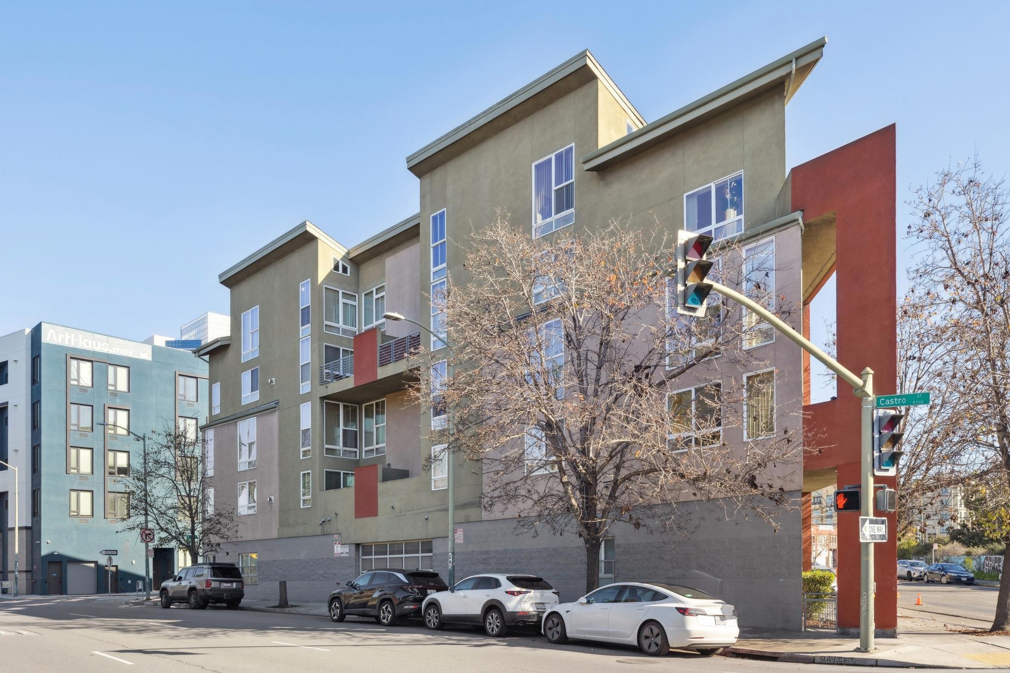675 8th Street, Unit 10 Oakland, CA 94607 - Photo 2 of 40 a front view of a building with cars