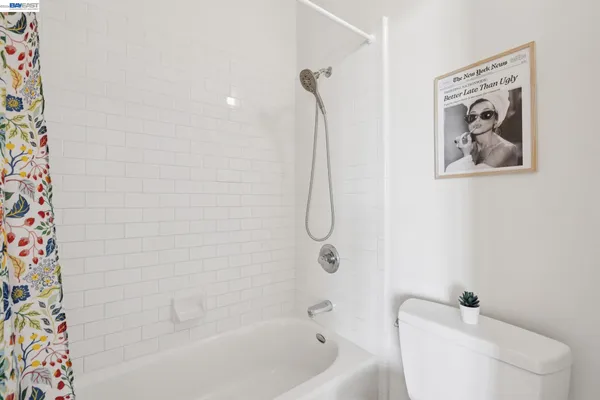 a bathroom with a toilet and shower