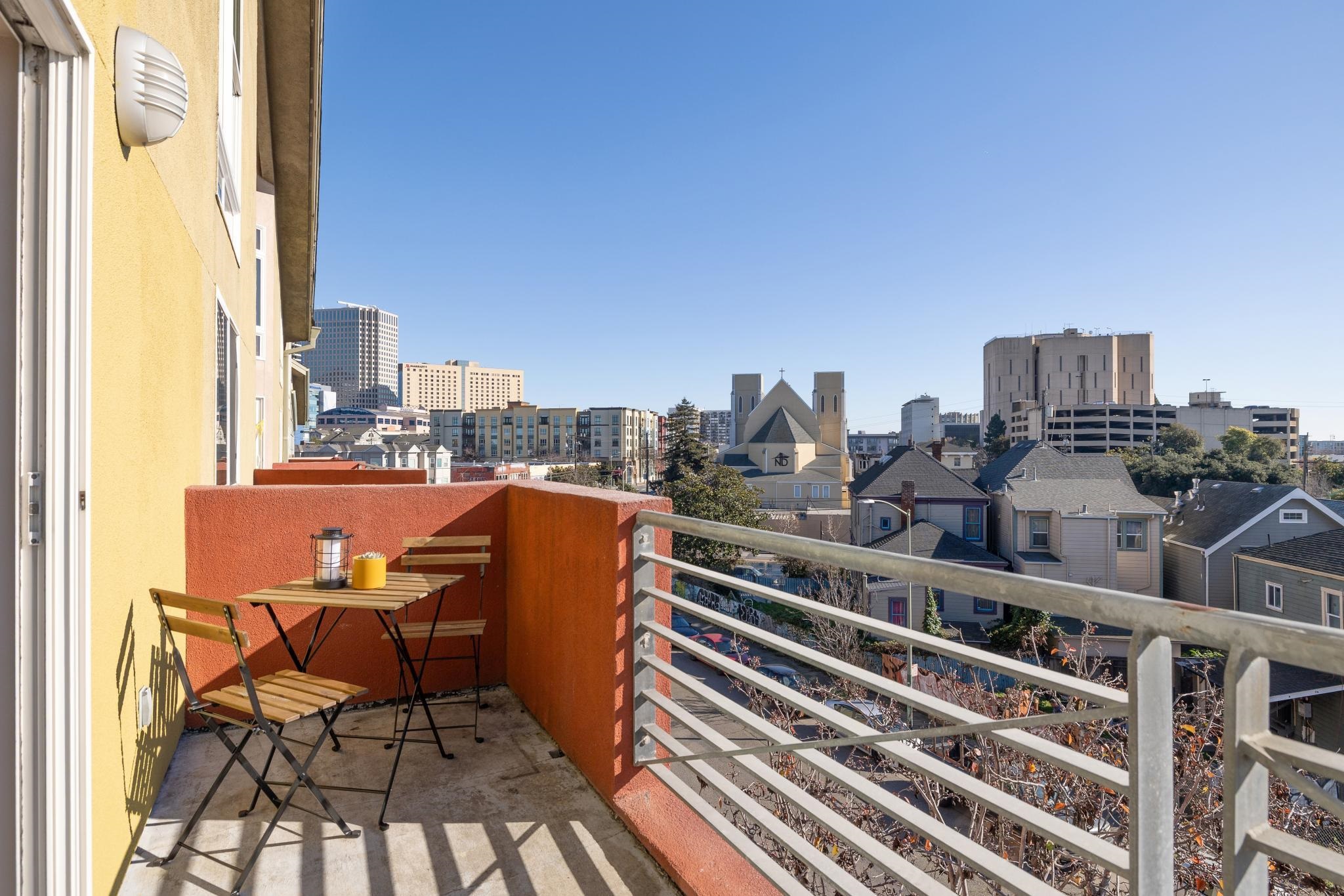 675 8th Street, Unit 10 Oakland, CA 94607 - Photo 28 of 40 a view of a balcony with chairs