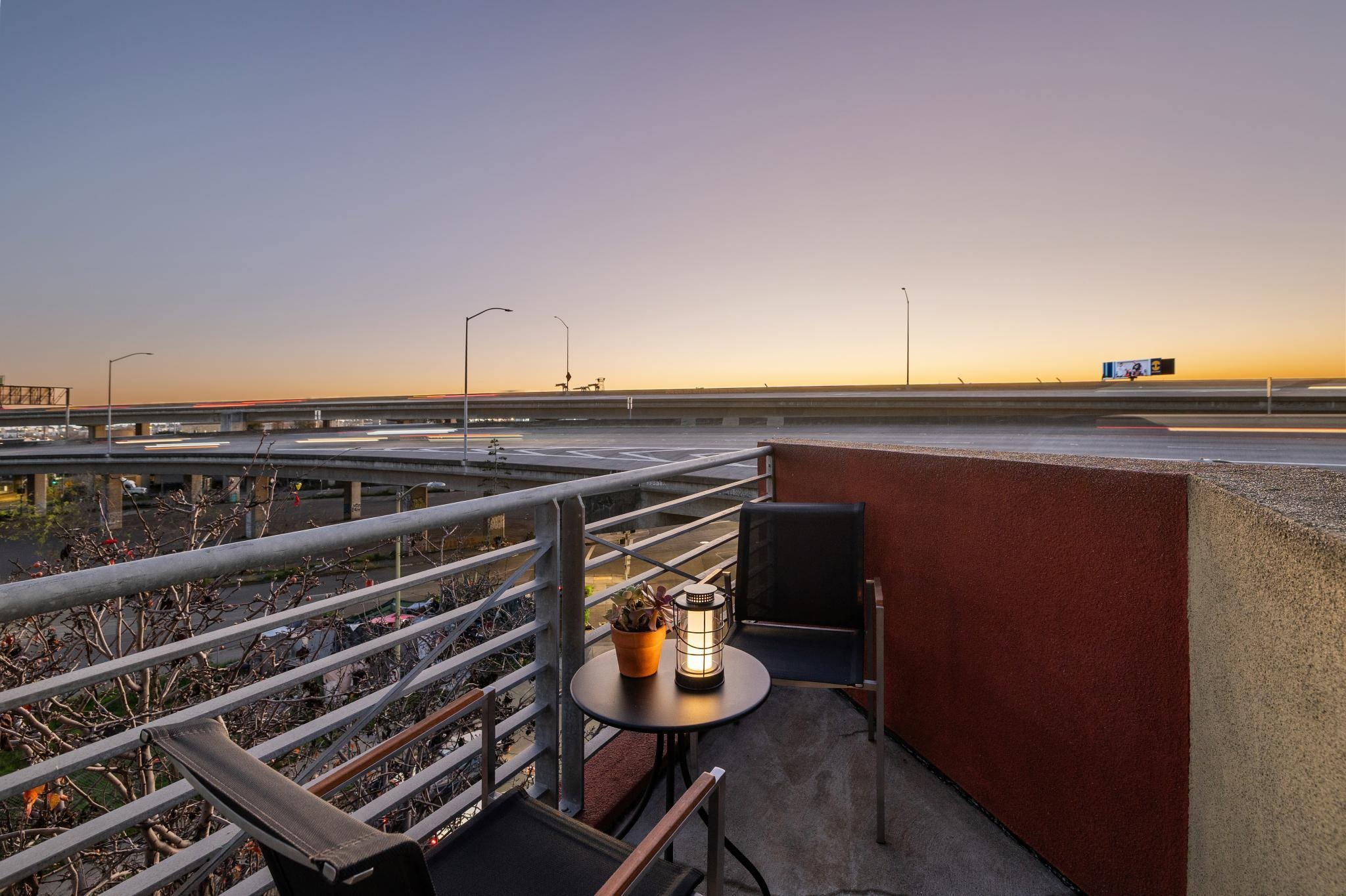675 8th Street, Unit 10 Oakland, CA 94607 - Photo 39 of 40 a view of a chairs and table on the terrace