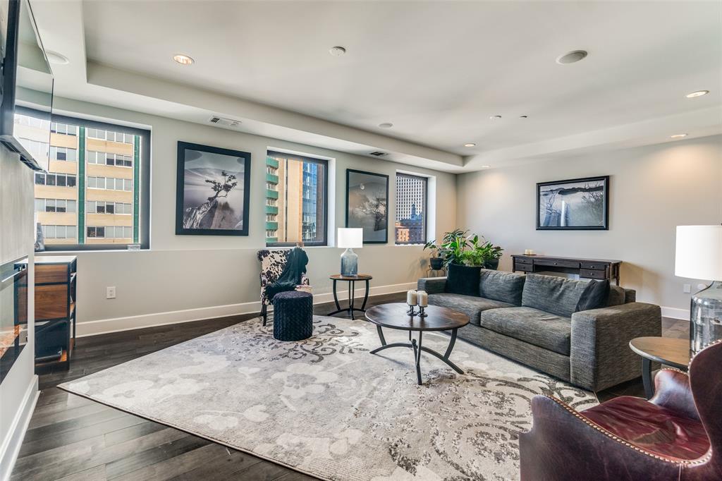 1505 Elm Street, Unit 1504 Dallas, TX 75201 - Photo 11 of 33 Living area featuring dark wood-style flooring, plenty of natural light, and recessed lighting