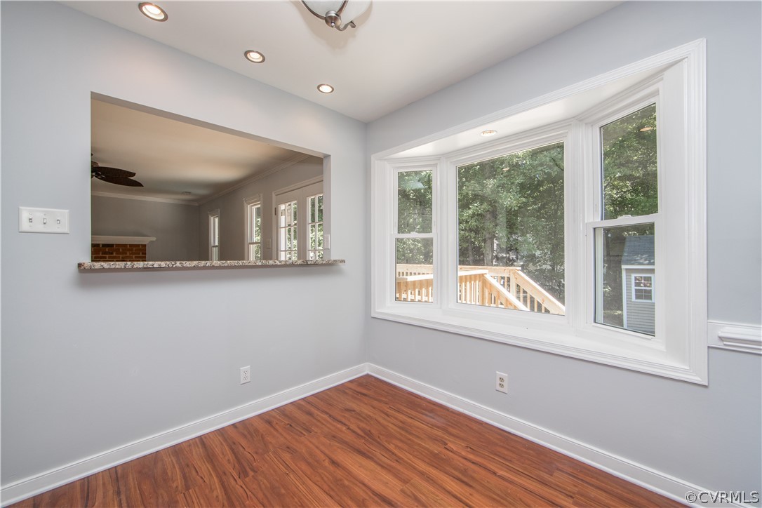4915 Cedar Cliff Road Chester, VA 23831 - Photo 12 of 35 a view of an empty room with wooden floor and a window