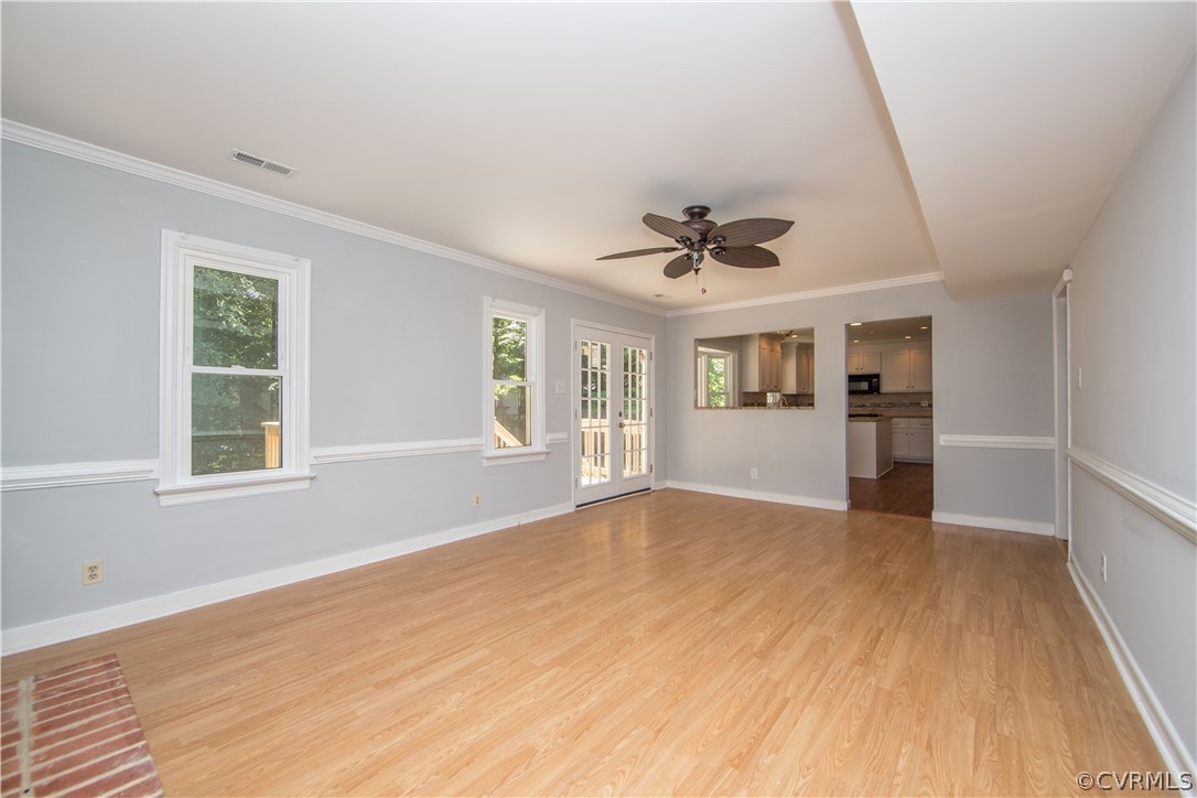 4915 Cedar Cliff Road Chester, VA 23831 - Photo 13 of 35 a view of an empty room with a window and wooden floor