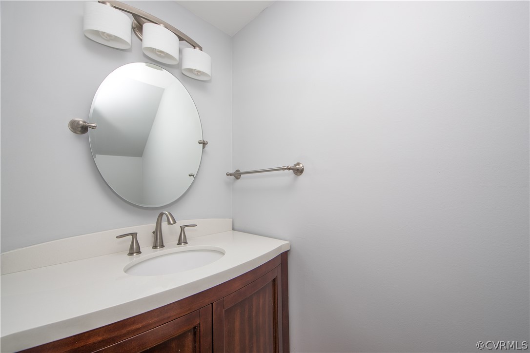 4915 Cedar Cliff Road Chester, VA 23831 - Photo 15 of 35 a bathroom with a sink and a mirror