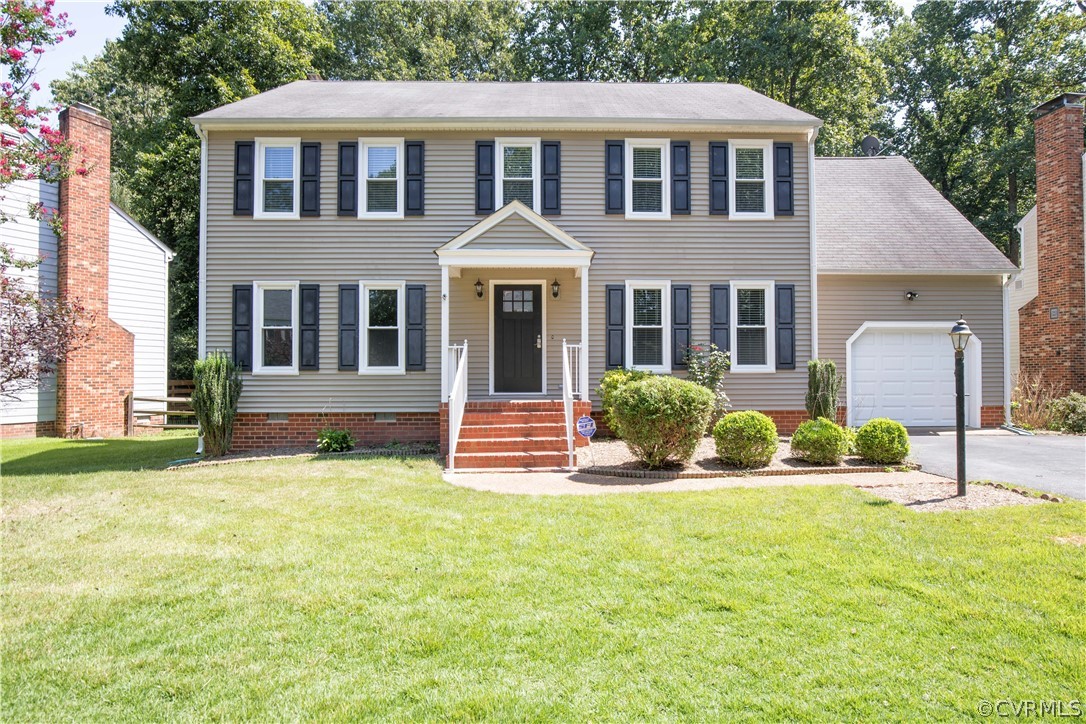 4915 Cedar Cliff Road Chester, VA 23831 - Photo 3 of 35 a front view of a house with a yard