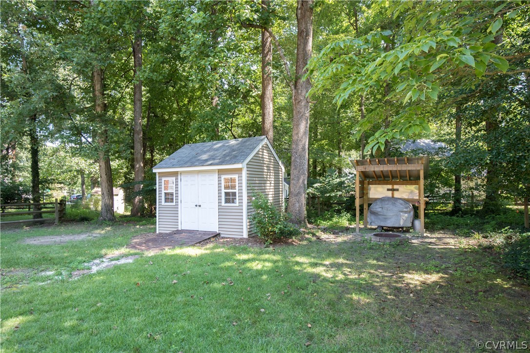 4915 Cedar Cliff Road Chester, VA 23831 - Photo 35 of 35 a view of a house with a yard and large trees