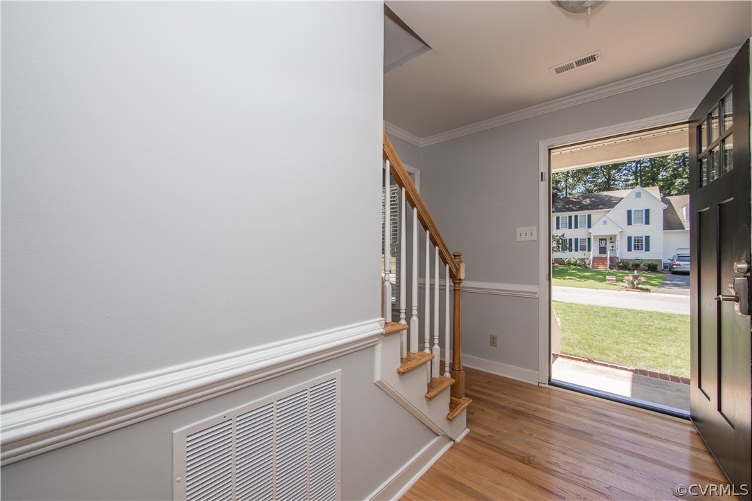 4915 Cedar Cliff Road Chester, VA 23831 - Photo 4 of 35 a view of an entryway with wooden floor and door