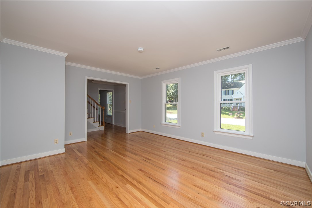 4915 Cedar Cliff Road Chester, VA 23831 - Photo 5 of 35 an empty room with wooden floor and windows