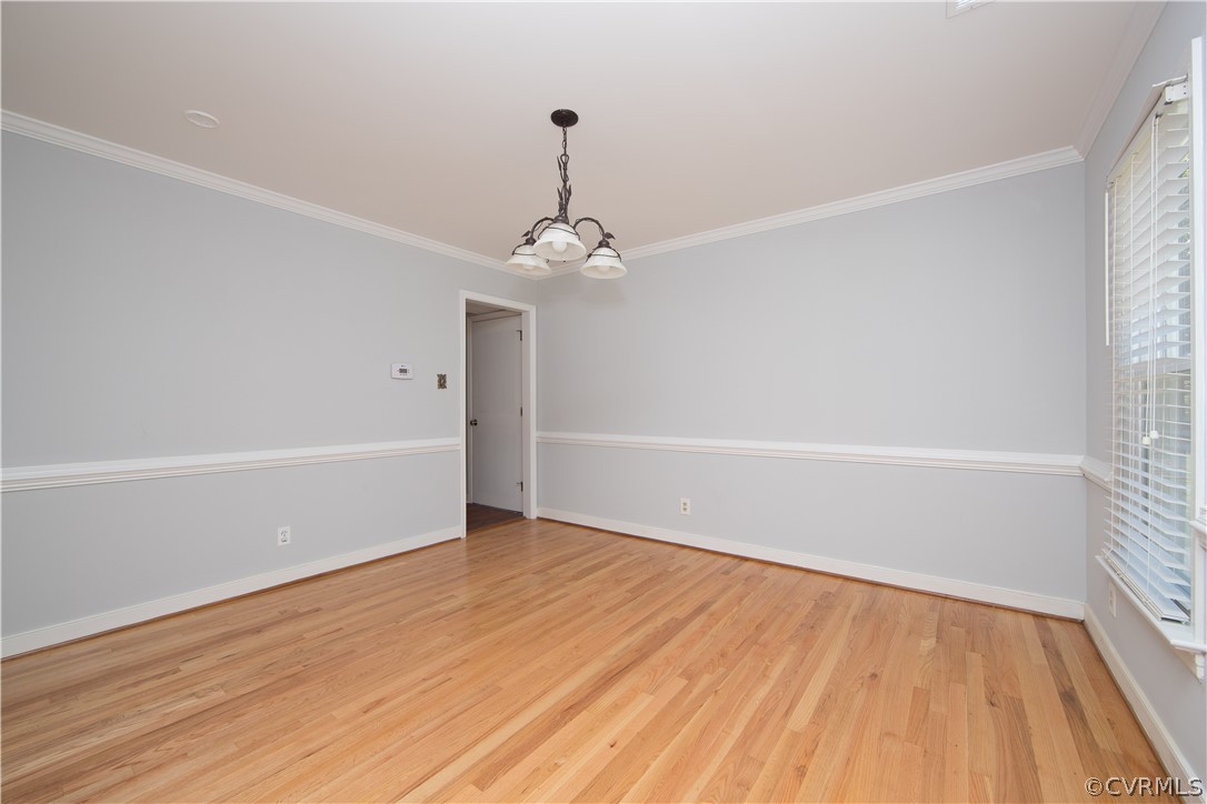 4915 Cedar Cliff Road Chester, VA 23831 - Photo 7 of 35 a view of a room with wooden floor and white walls