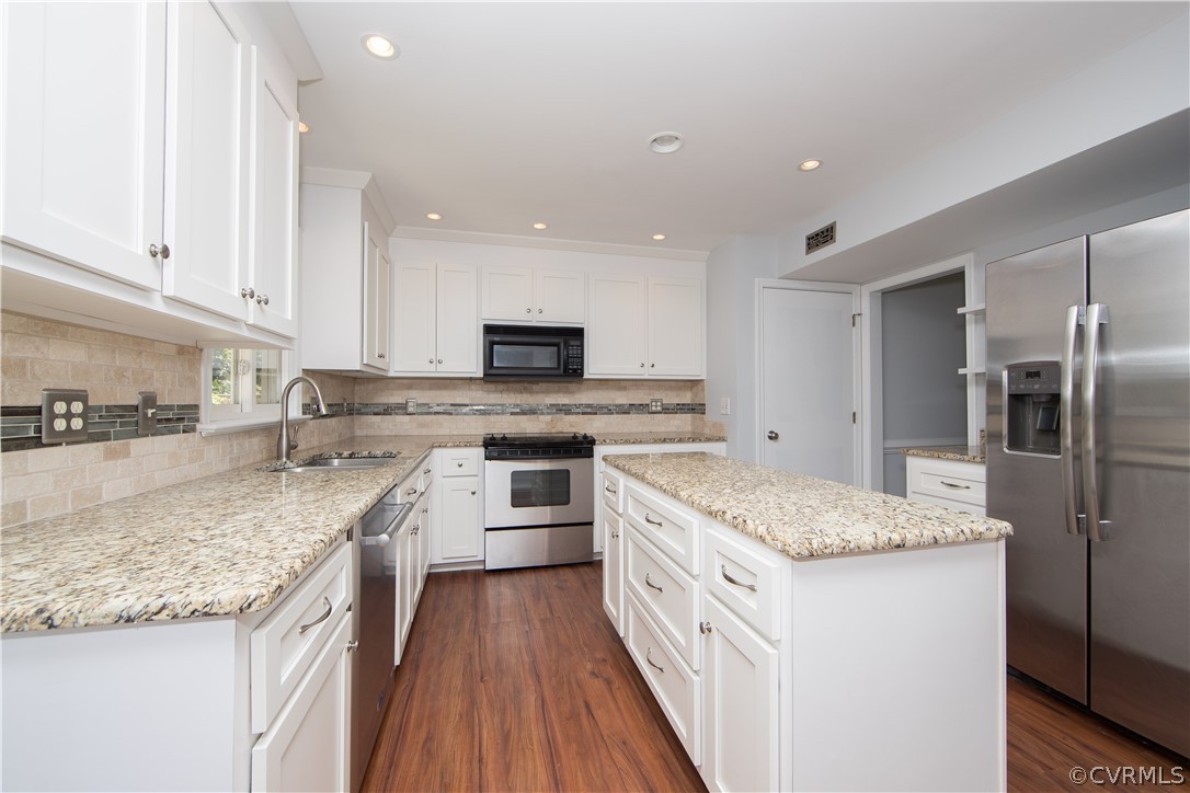 4915 Cedar Cliff Road Chester, VA 23831 - Photo 9 of 35 a kitchen with a sink stove and refrigerator