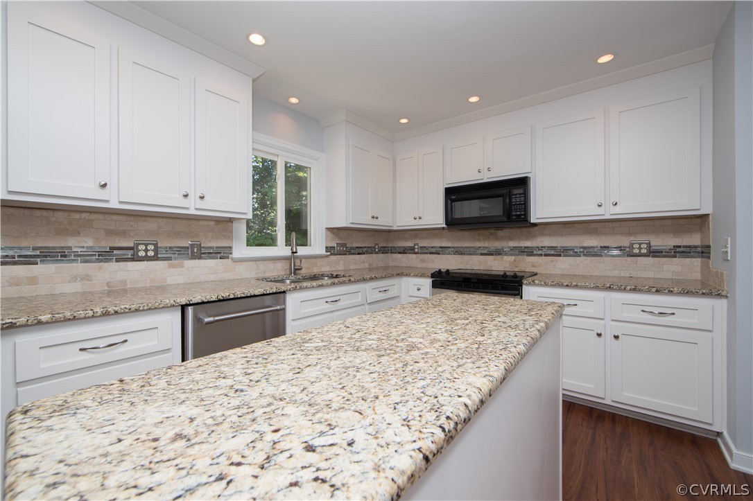 4915 Cedar Cliff Road Chester, VA 23831 - Photo 10 of 35 a kitchen with granite countertop wooden cabinets and a granite counter tops