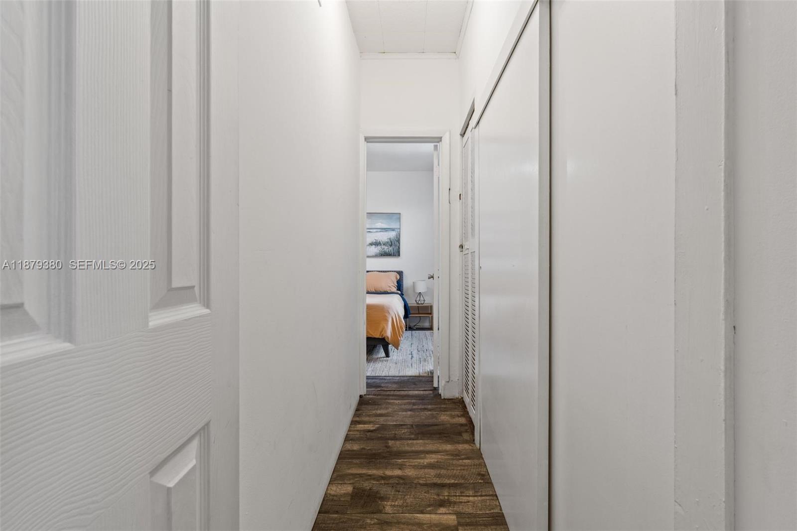 2453 Southwest 17th Street, Unit 2453 Miami, FL 33145 - Photo 11 of 22 a view of a hallway with wooden floor and entryway