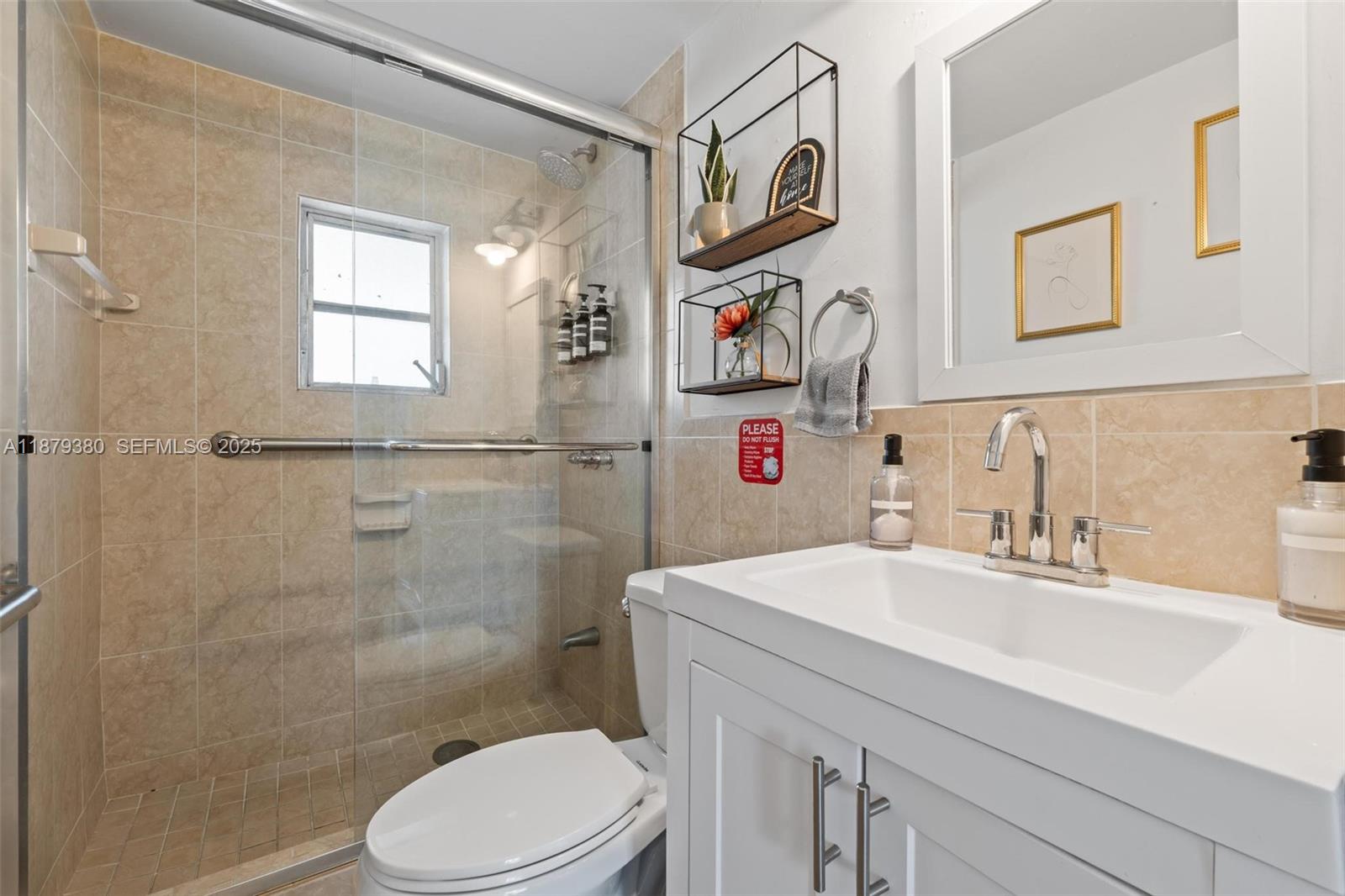 2453 Southwest 17th Street, Unit 2453 Miami, FL 33145 - Photo 17 of 22 a bathroom with a sink toilet and shower