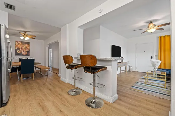 a workspace with furniture and wooden floor