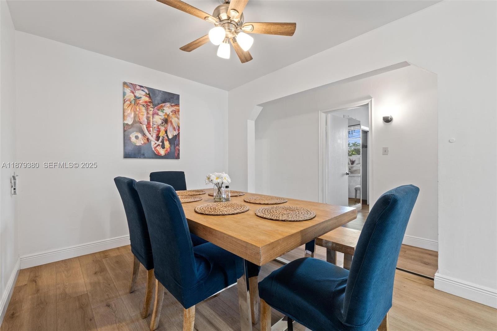 2453 Southwest 17th Street, Unit 2453 Miami, FL 33145 - Photo 9 of 22 a view of a dining room with furniture and wooden floor