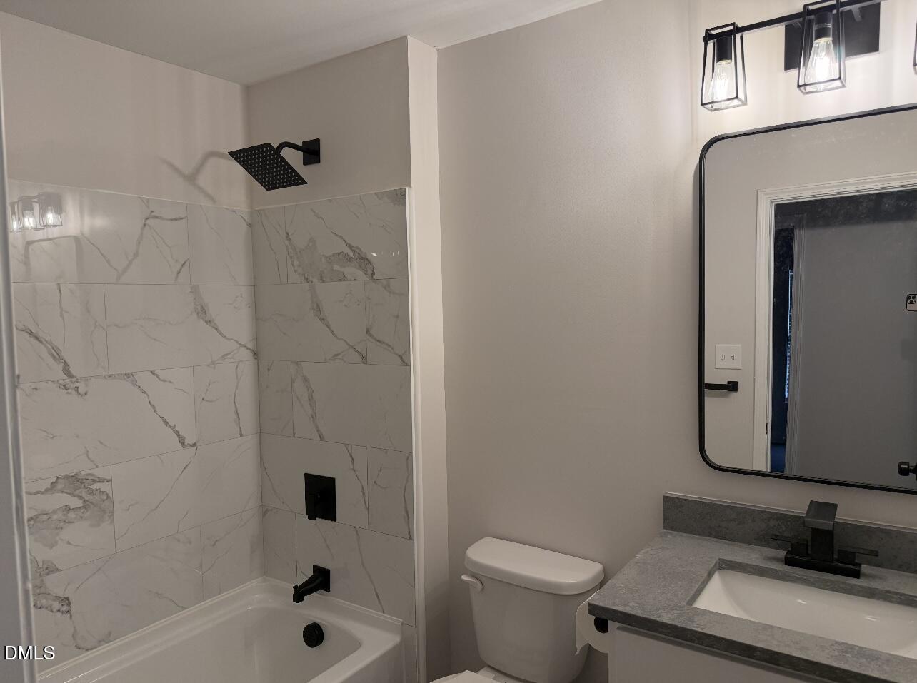 415 Sowell Street Durham, NC 27701 - Photo 11 of 19 a bathroom with a sink toilet a shower and bathtub