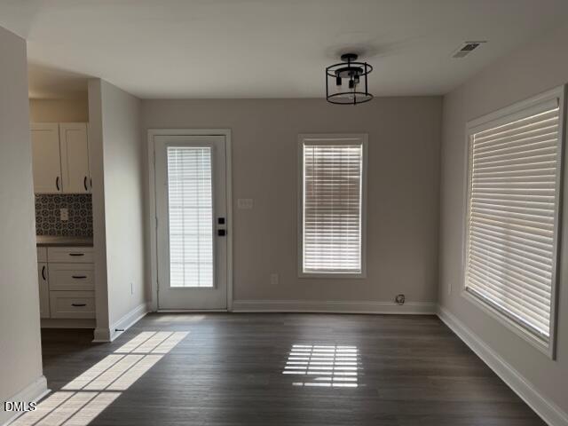 415 Sowell Street Durham, NC 27701 - Photo 16 of 19 a view of an empty room with wooden floor and a window