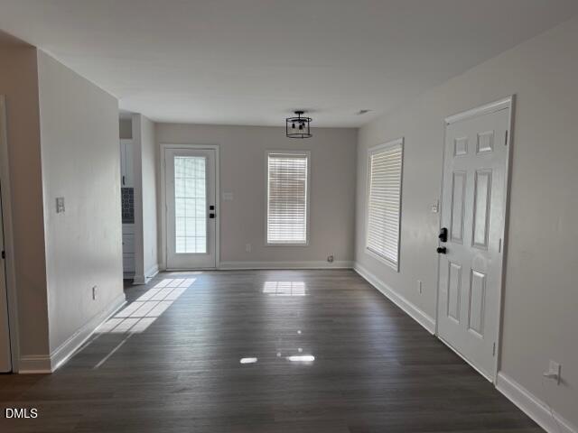 415 Sowell Street Durham, NC 27701 - Photo 17 of 19 a view of an empty room with wooden floor and a window