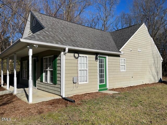 415 Sowell Street Durham, NC 27701 - Photo 4 of 19 a view of a house with a wooden fence