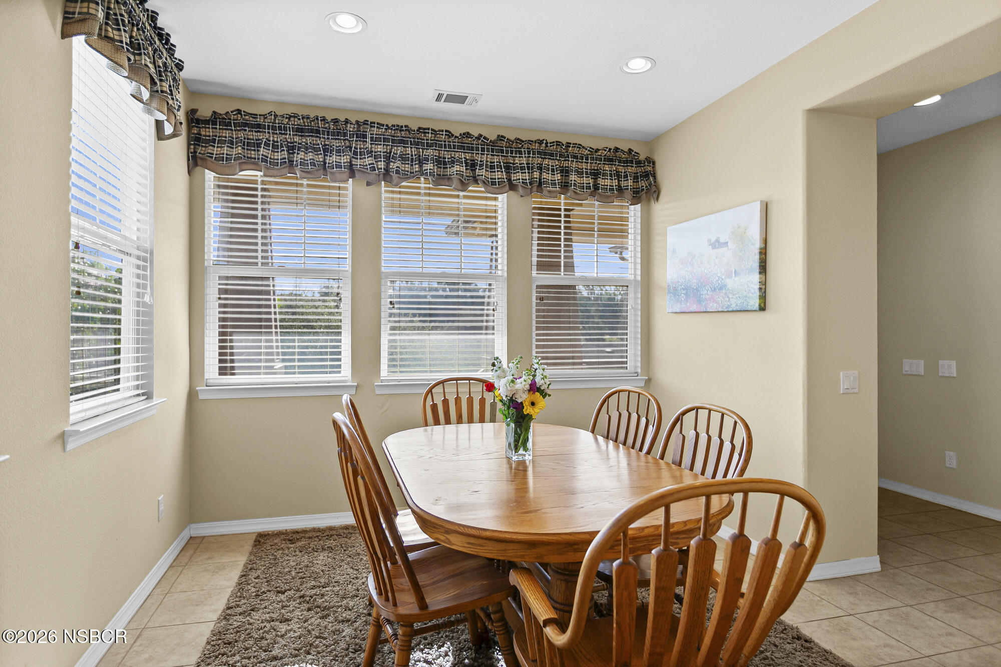 1557 Canyon Creek Road Santa Maria, CA 93455 - Photo 14 of 43 a view of a dining room with furniture and windows