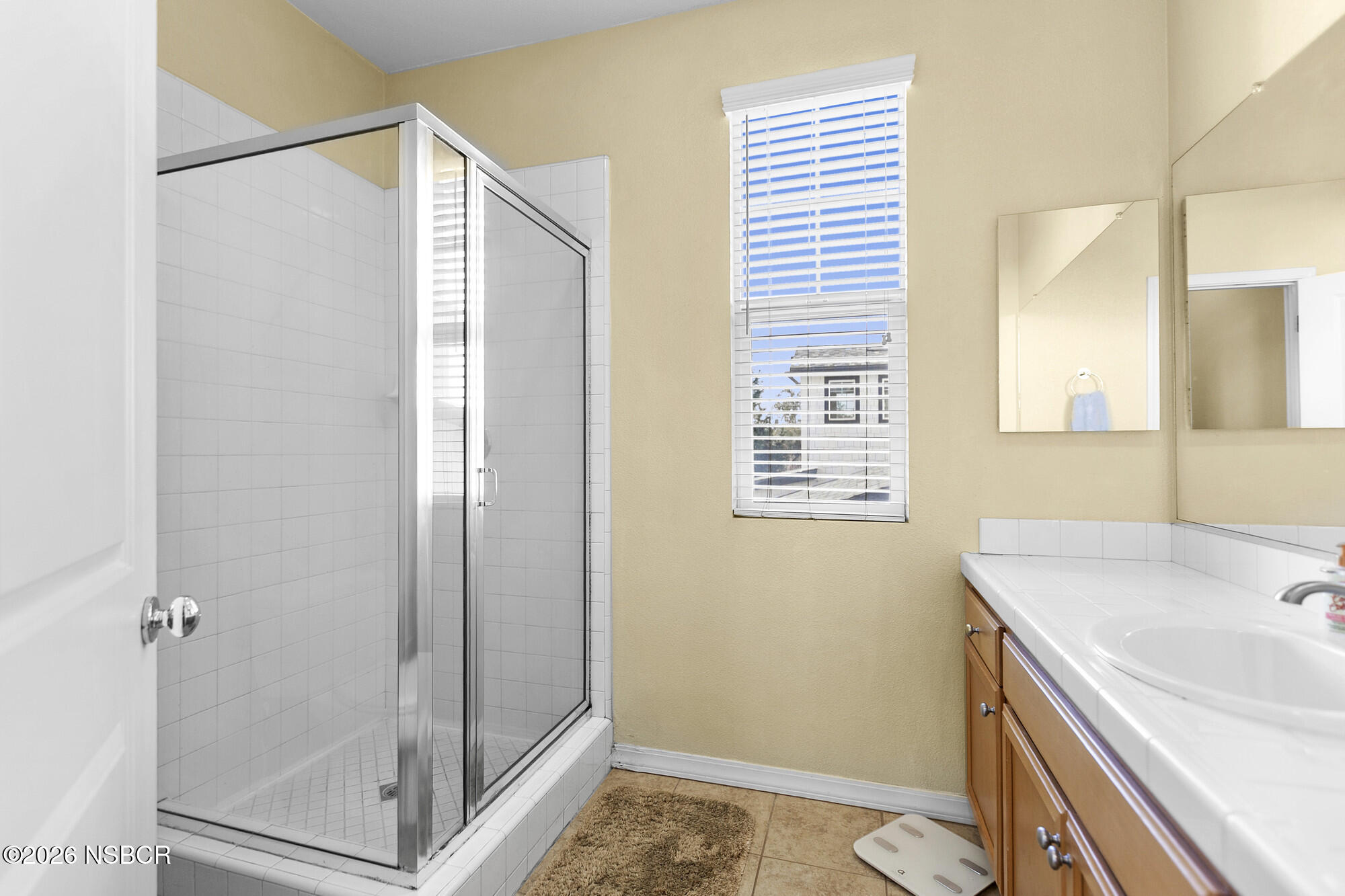 1557 Canyon Creek Road Santa Maria, CA 93455 - Photo 25 of 43 a bathroom with a sink and a shower