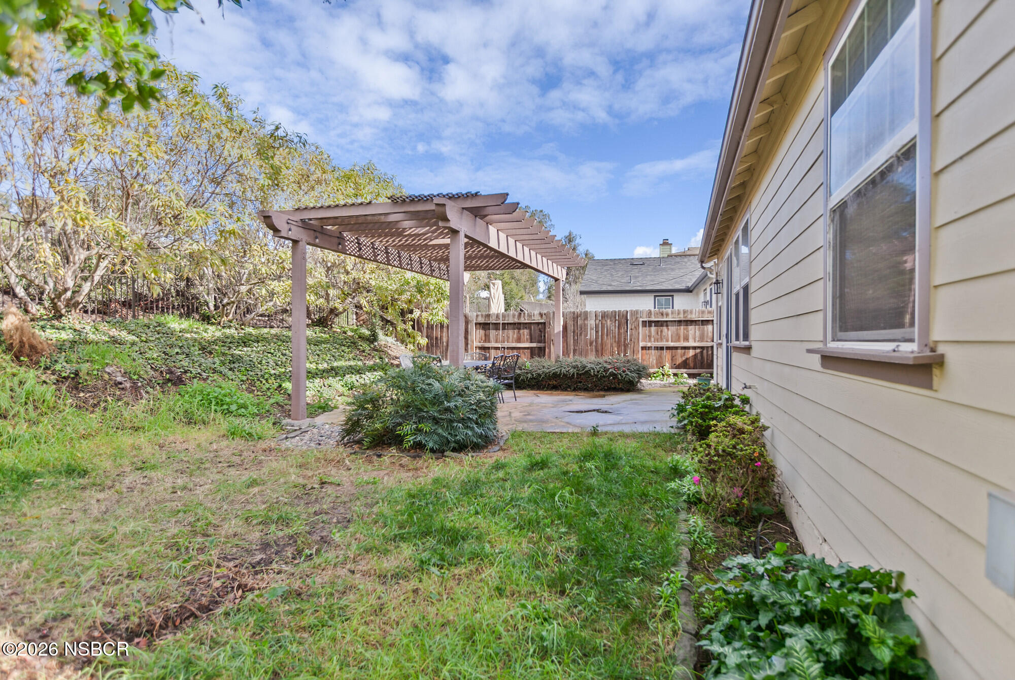 1557 Canyon Creek Road Santa Maria, CA 93455 - Photo 33 of 43 a view of a house with a small yard and plants