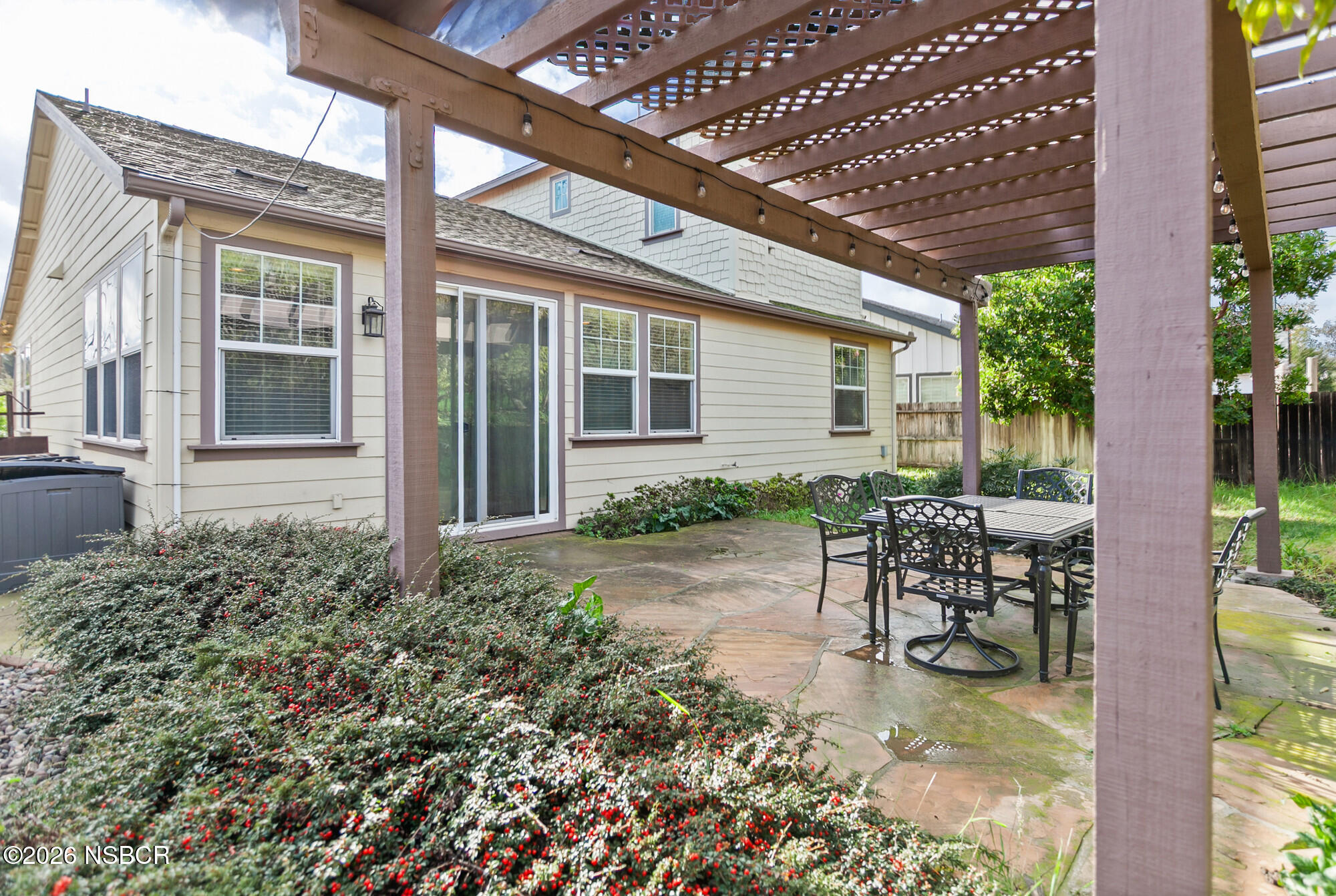 1557 Canyon Creek Road Santa Maria, CA 93455 - Photo 34 of 43 a view of a house with backyard sitting area and garden