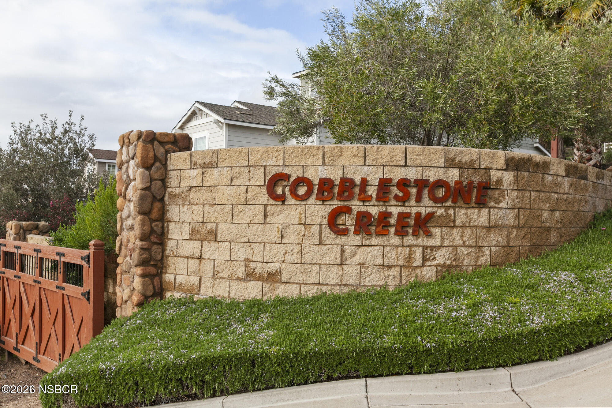 1557 Canyon Creek Road Santa Maria, CA 93455 - Photo 36 of 43 a sign on the side of building