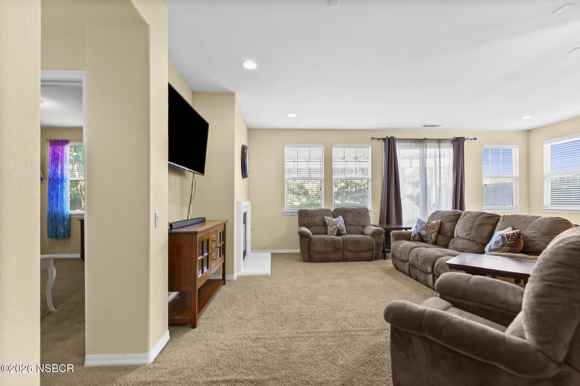 1557 Canyon Creek Road Santa Maria, CA 93455 - Photo 10 of 43 a living room with furniture and a flat screen tv