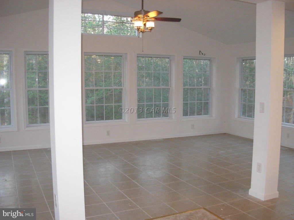 9409 Croppers Island Road Newark, MD 21841 - Photo 15 of 27 a view of an empty room with a window