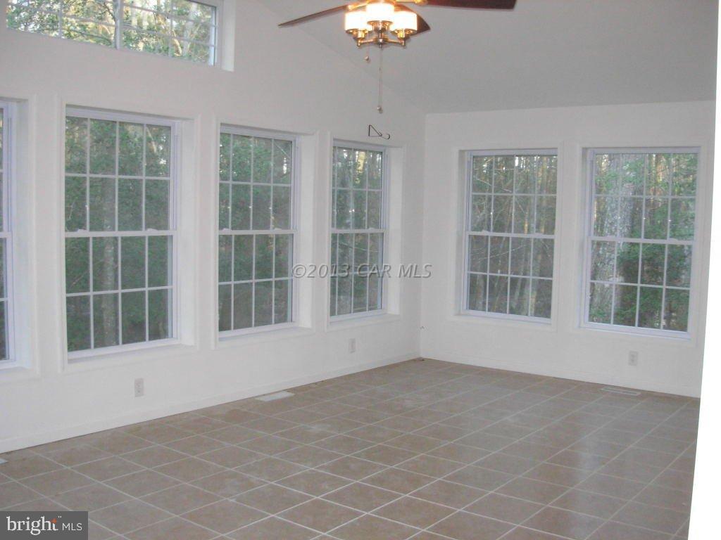 9409 Croppers Island Road Newark, MD 21841 - Photo 16 of 27 a view of an empty room with a window