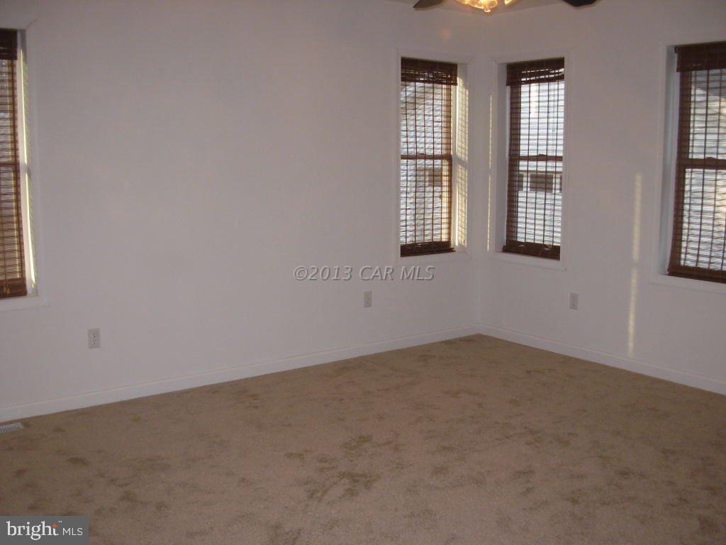9409 Croppers Island Road Newark, MD 21841 - Photo 17 of 27 an empty room with windows