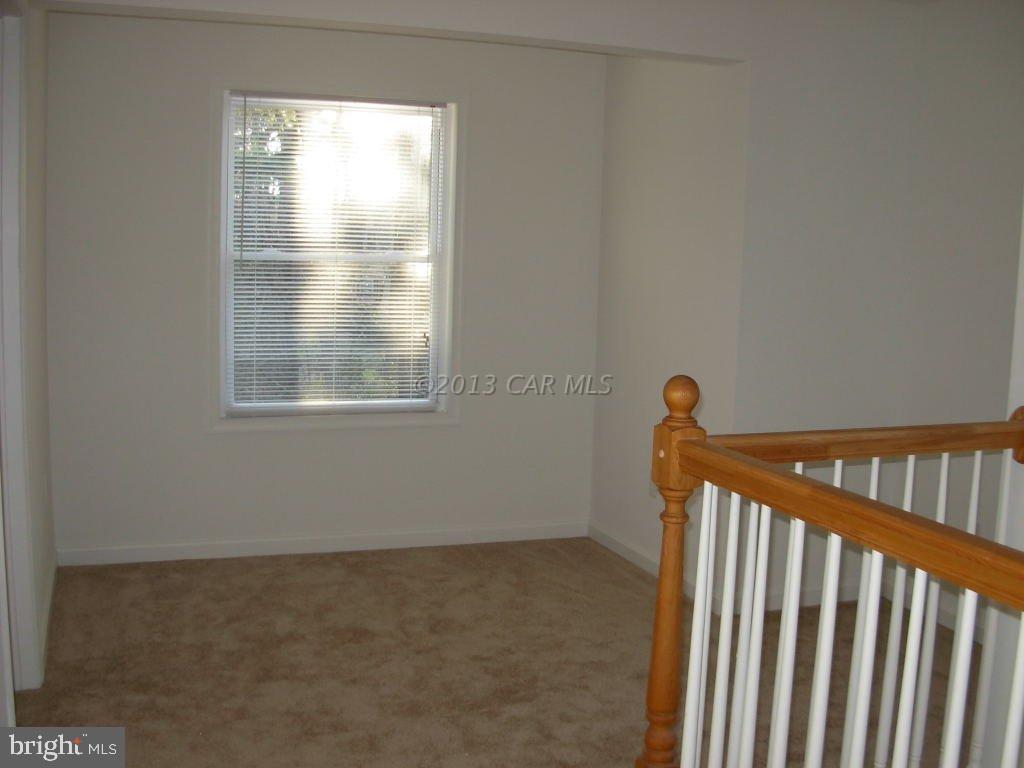 9409 Croppers Island Road Newark, MD 21841 - Photo 18 of 27 a view of a livingroom with an empty space and a window