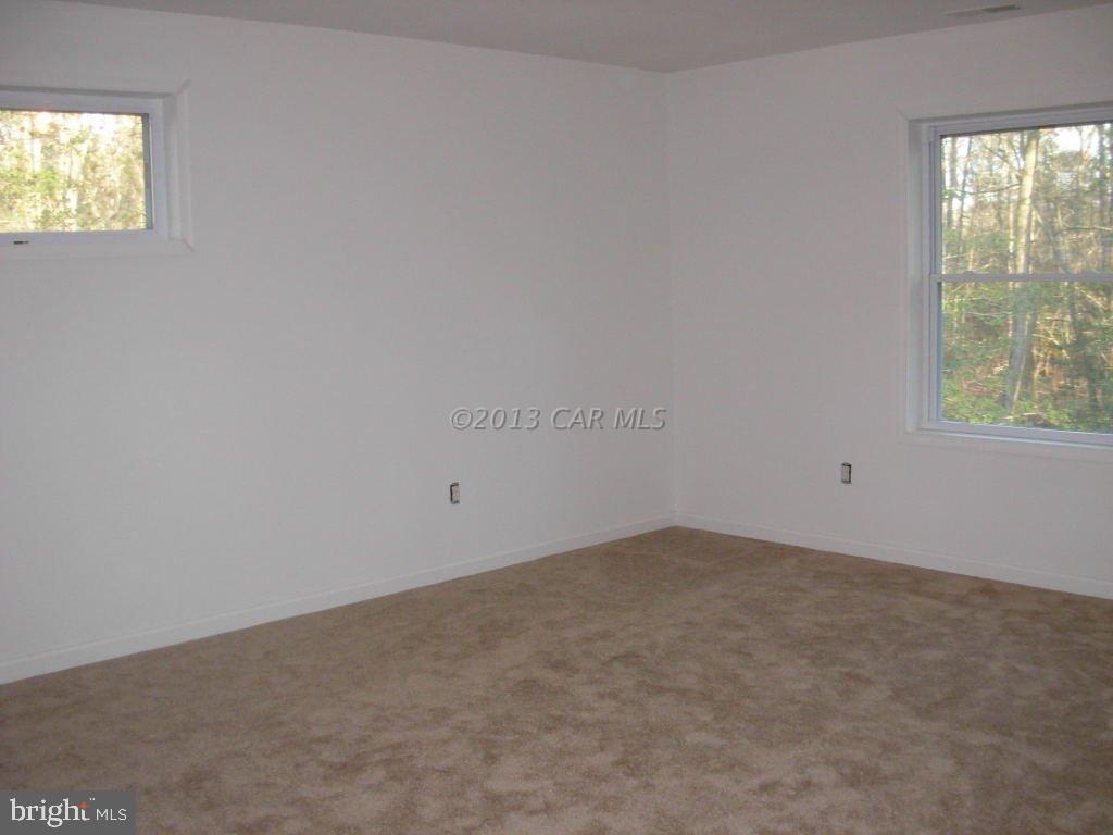 9409 Croppers Island Road Newark, MD 21841 - Photo 20 of 27 an empty room with windows