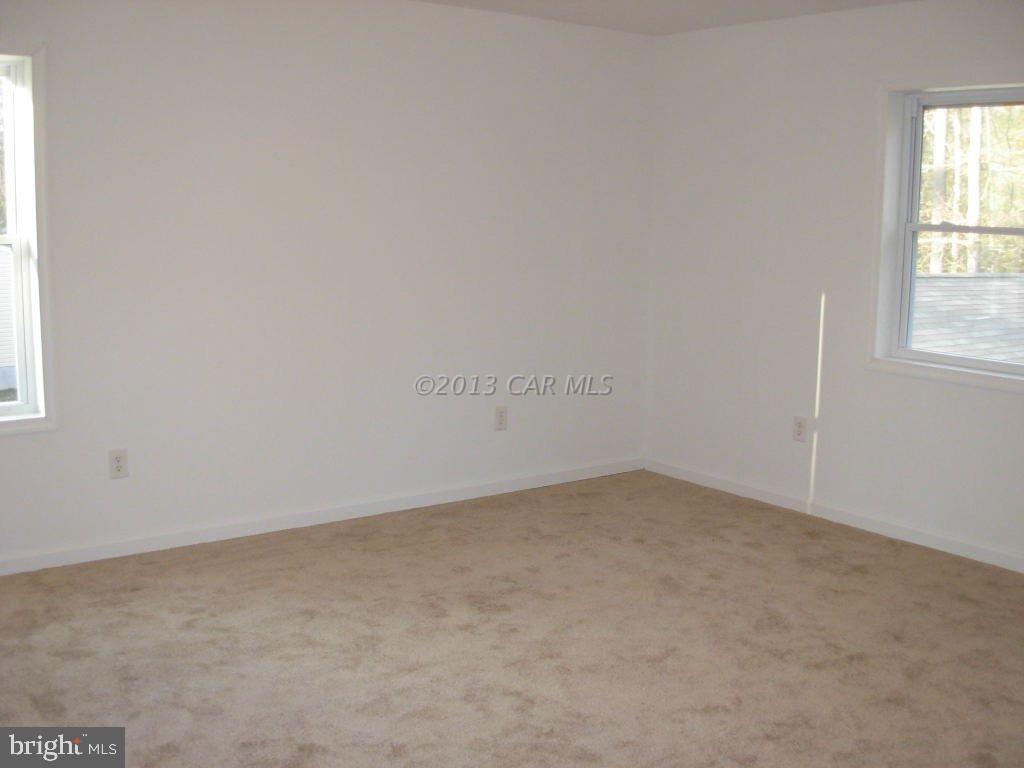 9409 Croppers Island Road Newark, MD 21841 - Photo 21 of 27 an empty room with a window