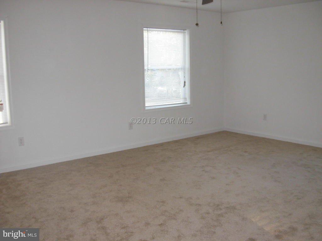 9409 Croppers Island Road Newark, MD 21841 - Photo 22 of 27 an empty room with a window