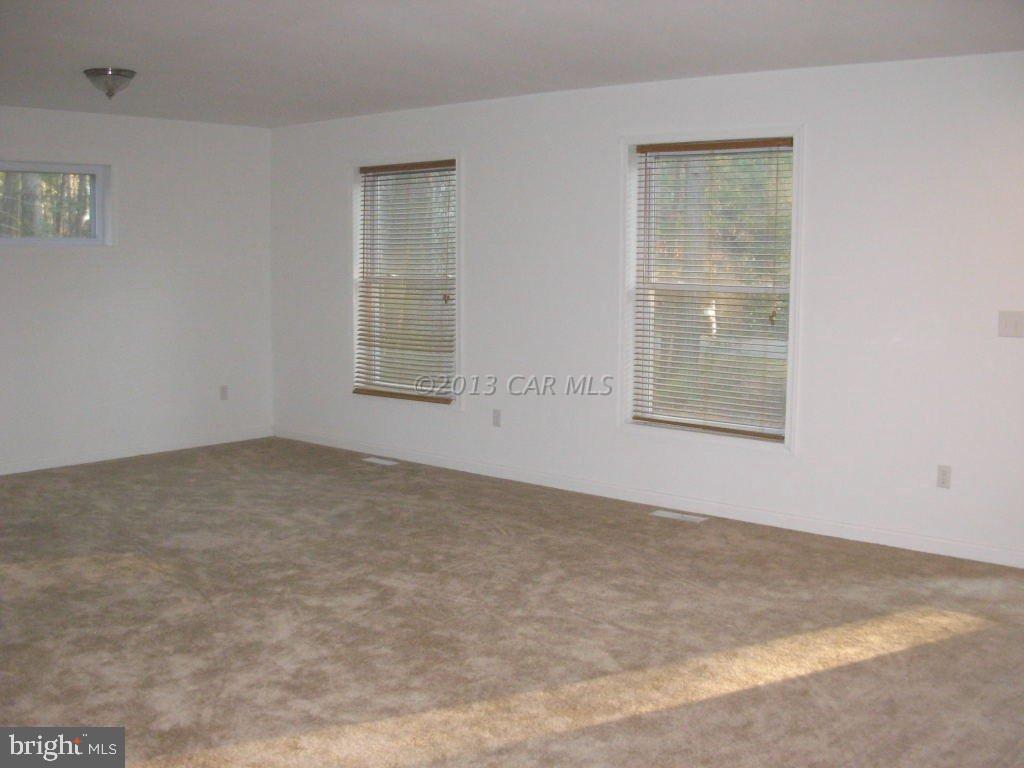 9409 Croppers Island Road Newark, MD 21841 - Photo 7 of 27 an empty room with windows