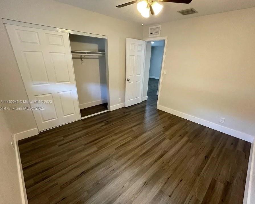 450 Southwest 2nd Street, Unit 4 Pompano Beach, FL 33060 - Photo 2 of 9 wooden floor in an empty room
