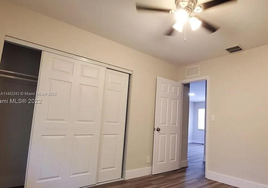 450 Southwest 2nd Street, Unit 4 Pompano Beach, FL 33060 - Photo 4 of 9 wooden floor in an empty room