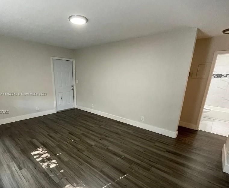 450 Southwest 2nd Street, Unit 4 Pompano Beach, FL 33060 - Photo 7 of 9 wooden floor in an empty room