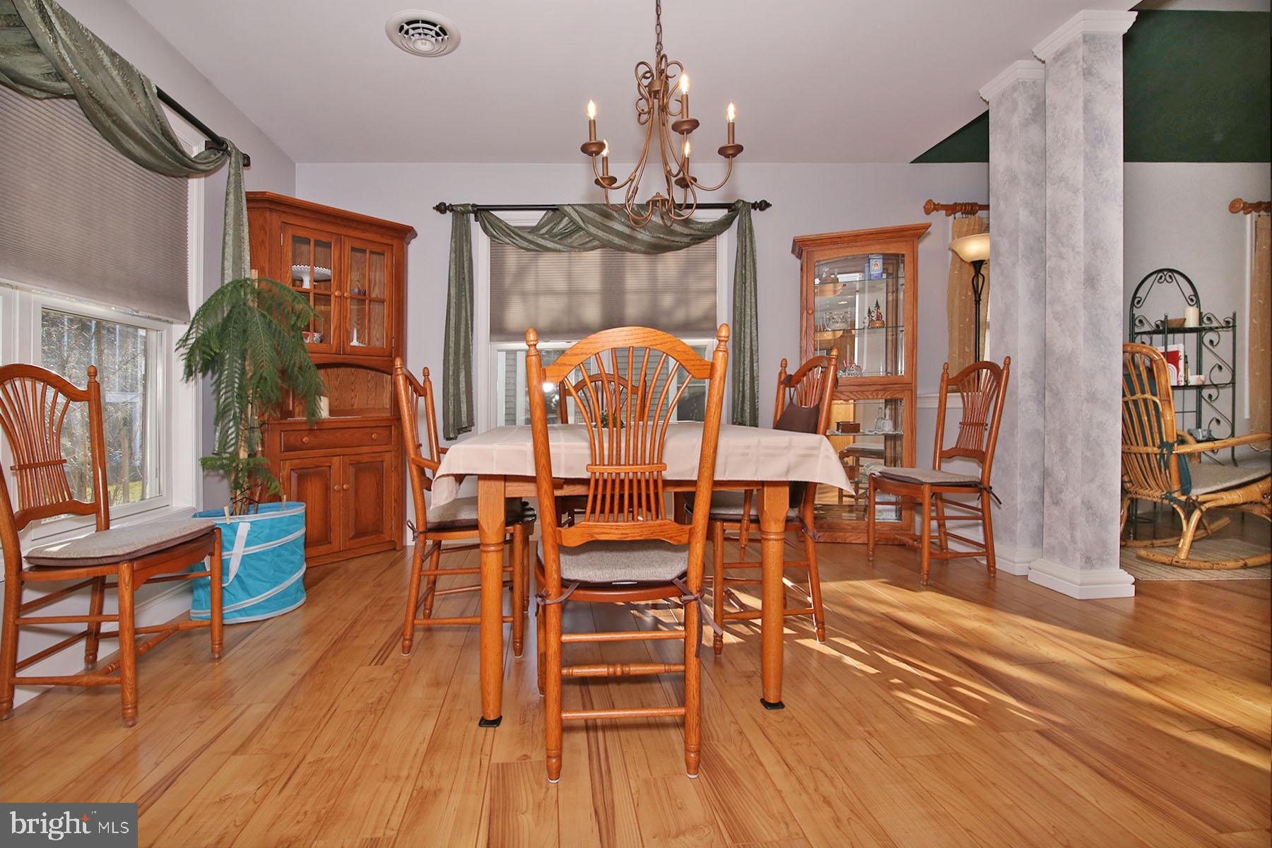 1023 Alden Way Lebanon, PA 17042 - Photo 12 of 74 a view of a dining room with furniture wooden floor and chandelier