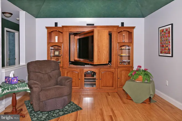 a bedroom with a bed and a chair