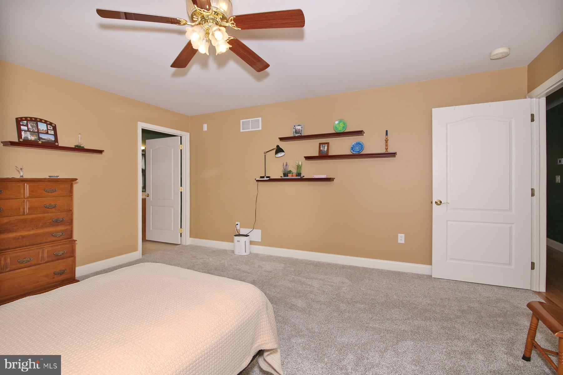 1023 Alden Way Lebanon, PA 17042 - Photo 29 of 74 a bedroom with a bed and a chandelier
